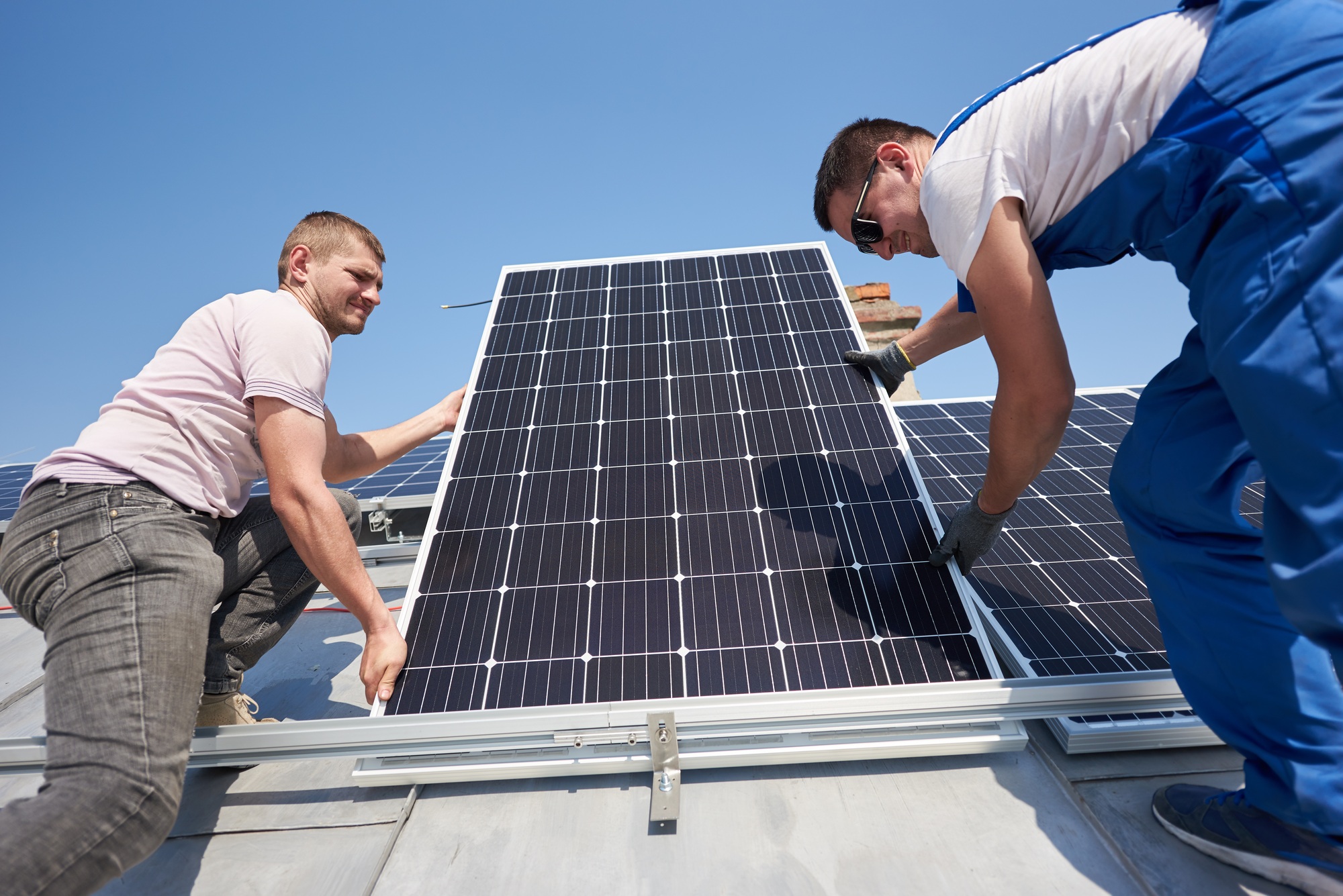 Installing solar photovoltaic panel system on roof of house
