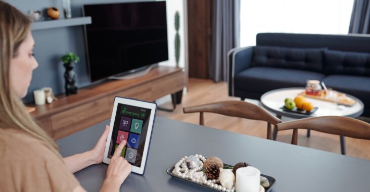 Woman using home control app